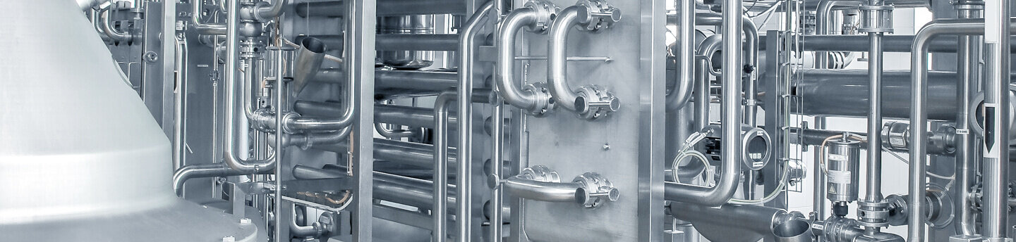 Brilliant aluminium metal tubes in an industrial plant.