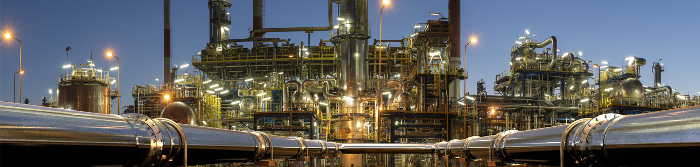 Pipelines leading to an oil refinery.